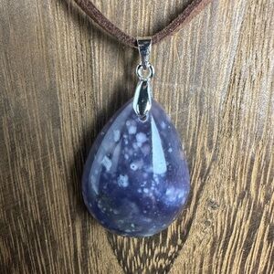 Starry Sky Agate Teardrop Pendant Necklace on Dark Brown Faux Suede